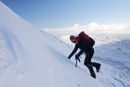 09-9747 Kicking Steps onto the Summit Plateau of Cross Fell with the Dun Fells in the Background. North Pennines